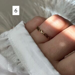 Minimalist hollow stainless steel heart-shaped thin ring.